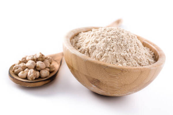 Is Chickpea Flour Keto? What You Need to Know 5 Chickpeas and ground chickpeas in a wooden bowl