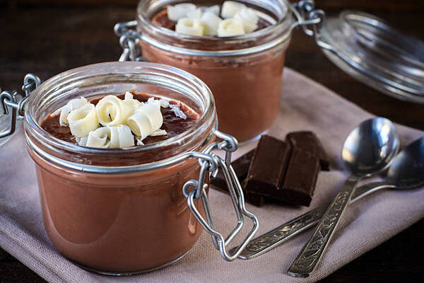 Easy Homemade Keto Chocolate Pudding Ready in Minutes 7 Homemade chocolate pudding served with chocolate shavings in glass jars