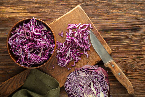 Carbs in Cabbage Explained: A Simple Low-Carb Guide 4 Chopped red cabbage on a wooden board