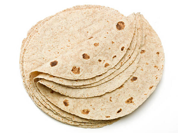 Best Keto Wraps to Buy or Make at Home Today 4 A stack of store-bought wheat flour tortillas