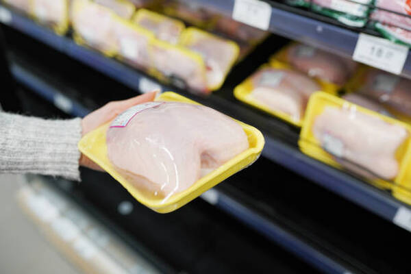 Is Canned Chicken Healthy? What You Need to Know 5 Woman choosing packed chicken meat in supermarket