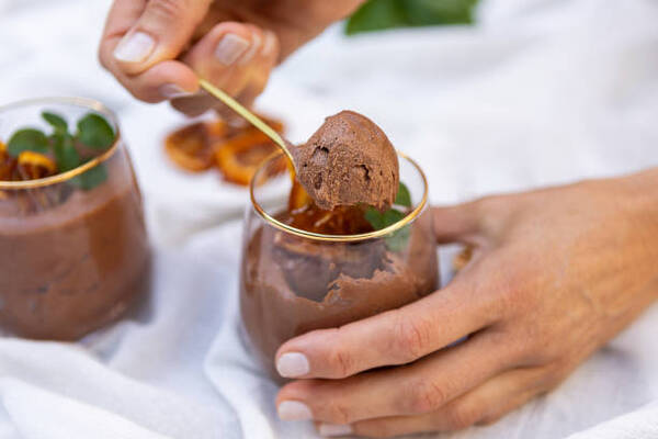 Easy Keto Chocolate Mousse Recipe for a Quick Dessert Fix 2 Delicious chocolate mousse dessert with caramelized oranges served in a glass cup