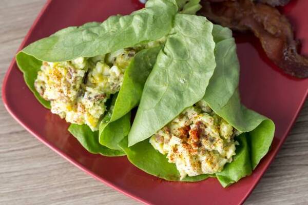 Easy Egg Salad Lettuce Wrap Recipe for a Quick Lunch 2 A plate with egg salad wrapped in lettuce with bacon