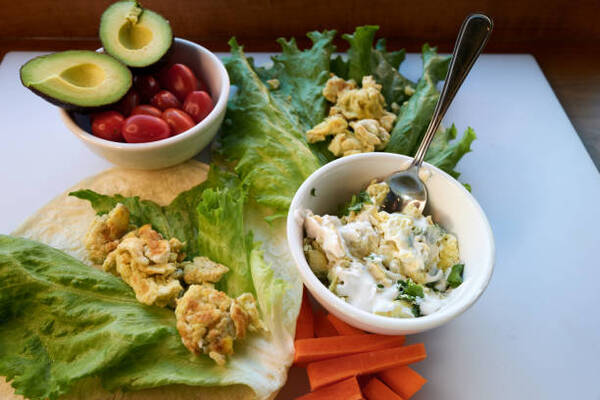Easy Egg Salad Lettuce Wrap Recipe for a Quick Lunch 4 Making an egg salad wrap with lettuce, tomato, and avocado