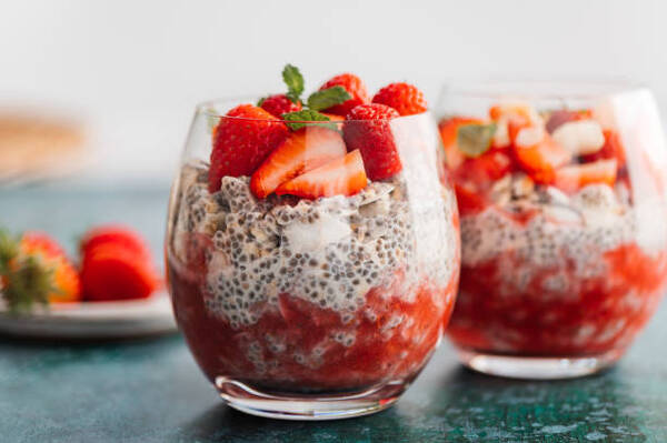 Delicious Low-Carb Chia Pudding Recipe Perfect for Any Day 8 Healthy chia pudding in a glass with fresh strawberries made from almond milk and berry juice