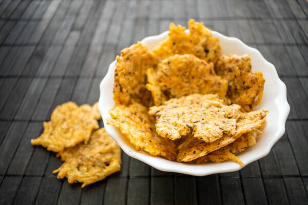 Top 10 Keto Snacks on the Go for Busy Days 4 Homemade crunchy cheese crisps in a bowl