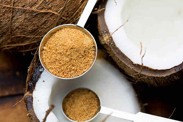 Is Coconut Sugar Keto or Just Another Sweetener Trap? 7 Mature coconut meat with coconut sugar in spoons