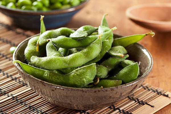 Beans on Keto: Can They Fit Into Your Meal Plan? 7 Cooked edamame beans with sea salt in a bowl