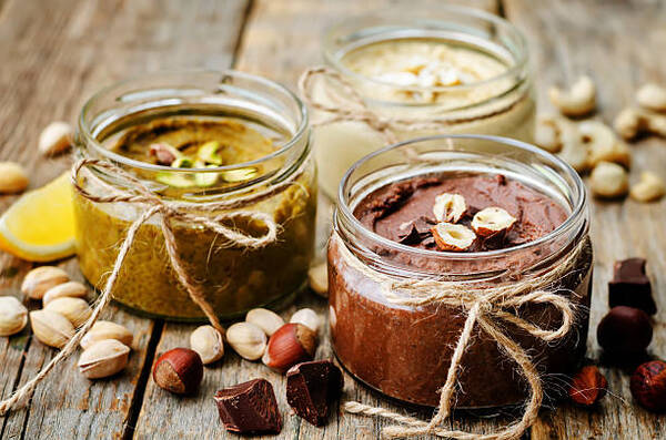 Top 10 Keto Snacks on the Go for Busy Days 3 Toasted nut butters, pistachio, hazelnut and cashew nut butter in glass jars