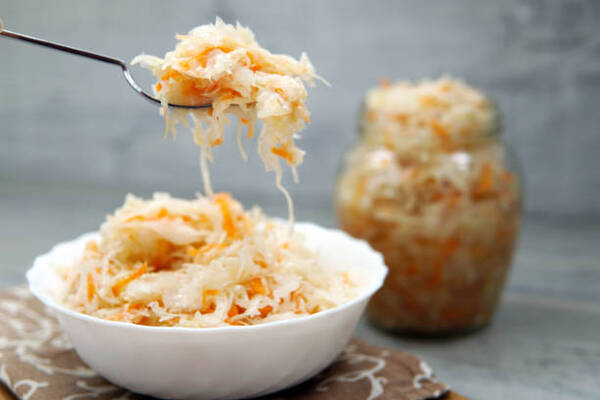 Is Sauerkraut Keto or Not? What You Need to Know 2 Homemade sauerkraut in a plate and on a fork