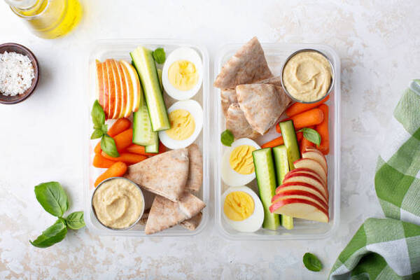 Top 10 Keto Snacks on the Go for Busy Days 15 Healthy lunch or snack boxes to go with hummus and pita, eggs and vegetables