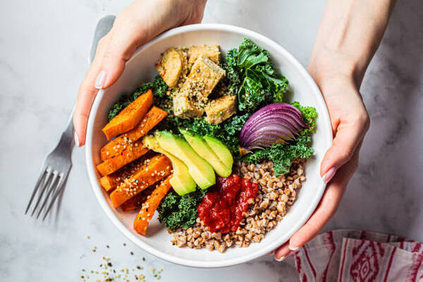 Exploring the Vegetarian Paleo Diet: What You Need to Know 8 Vegan lunch salad with baked vegetables, avocado, kale, and sweet potato