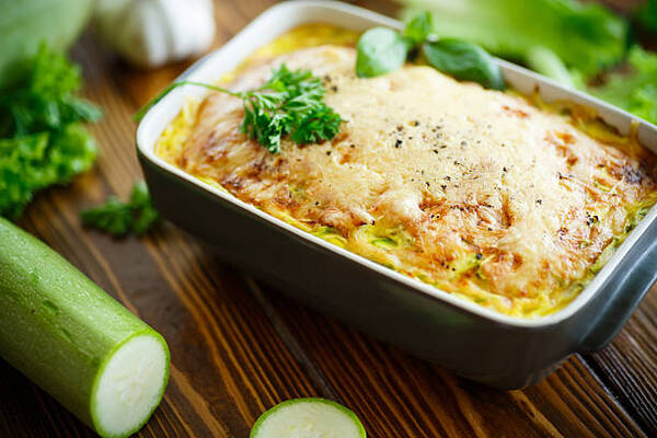 Hearty Hamburger Zucchini Casserole for the Whole Family 5 A casserole with cheese and zucchini in a baking dish