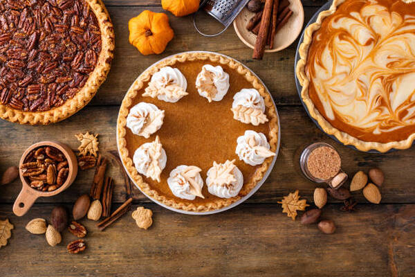 Variety of traditional Thanksgiving pies including pumpkin and pecan pies